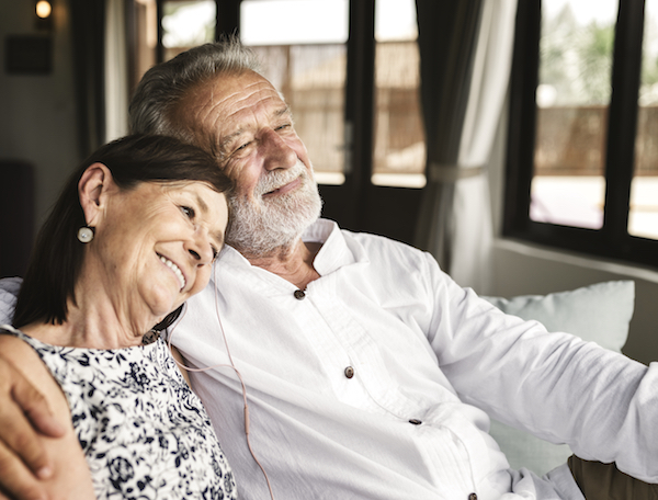 a man and woman sitting on a couch