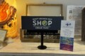 a display of signs and other items on a table at one of the local shops in Cedar Park Texas