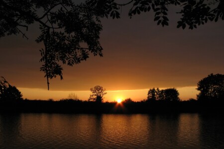 a sunset over a body of water