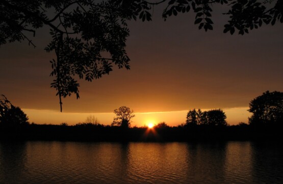 a sunset over a body of water