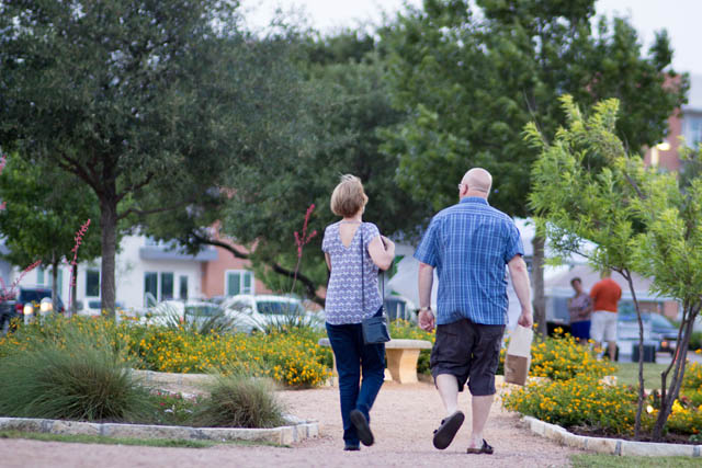 a middle age couple enjoying a casual walk in Cedar Park Texas