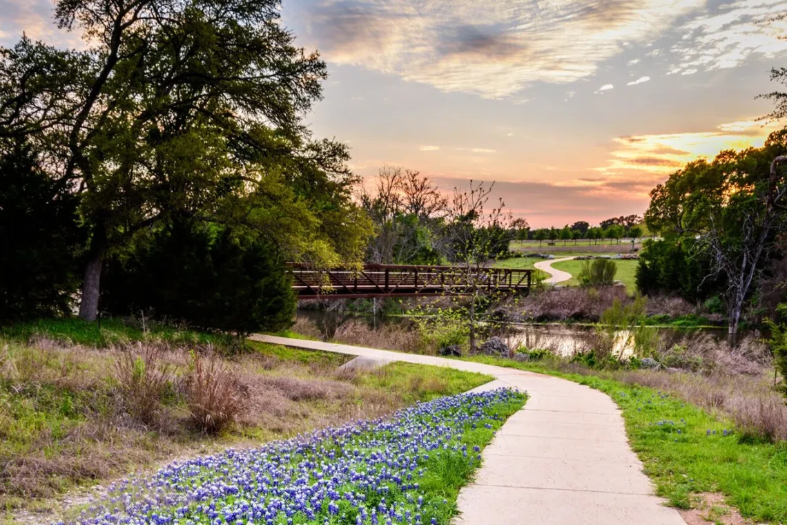 Lush greenery and scenic trails at Brushy Creek Park in Cedar Park, Texas.